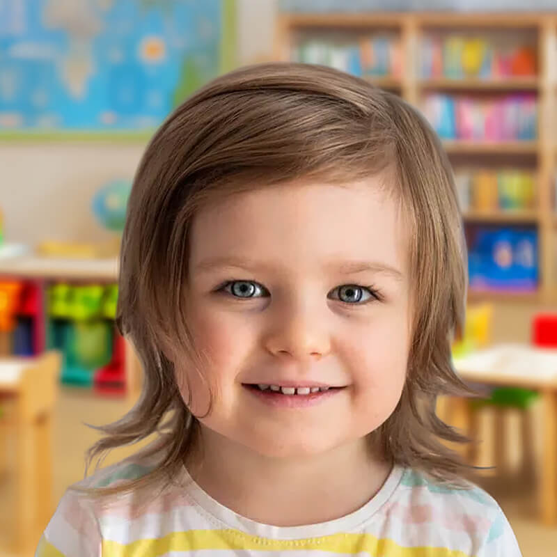 A cheerful little girl with sparkling blue eyes and a warm smile, embodying joy and playfulness in a vibrant environment.