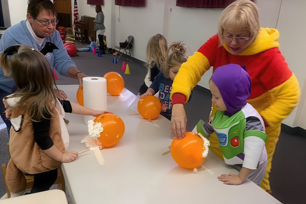 A heartwarming scene of children in costumes decorating, highlighting individualized learning experiences